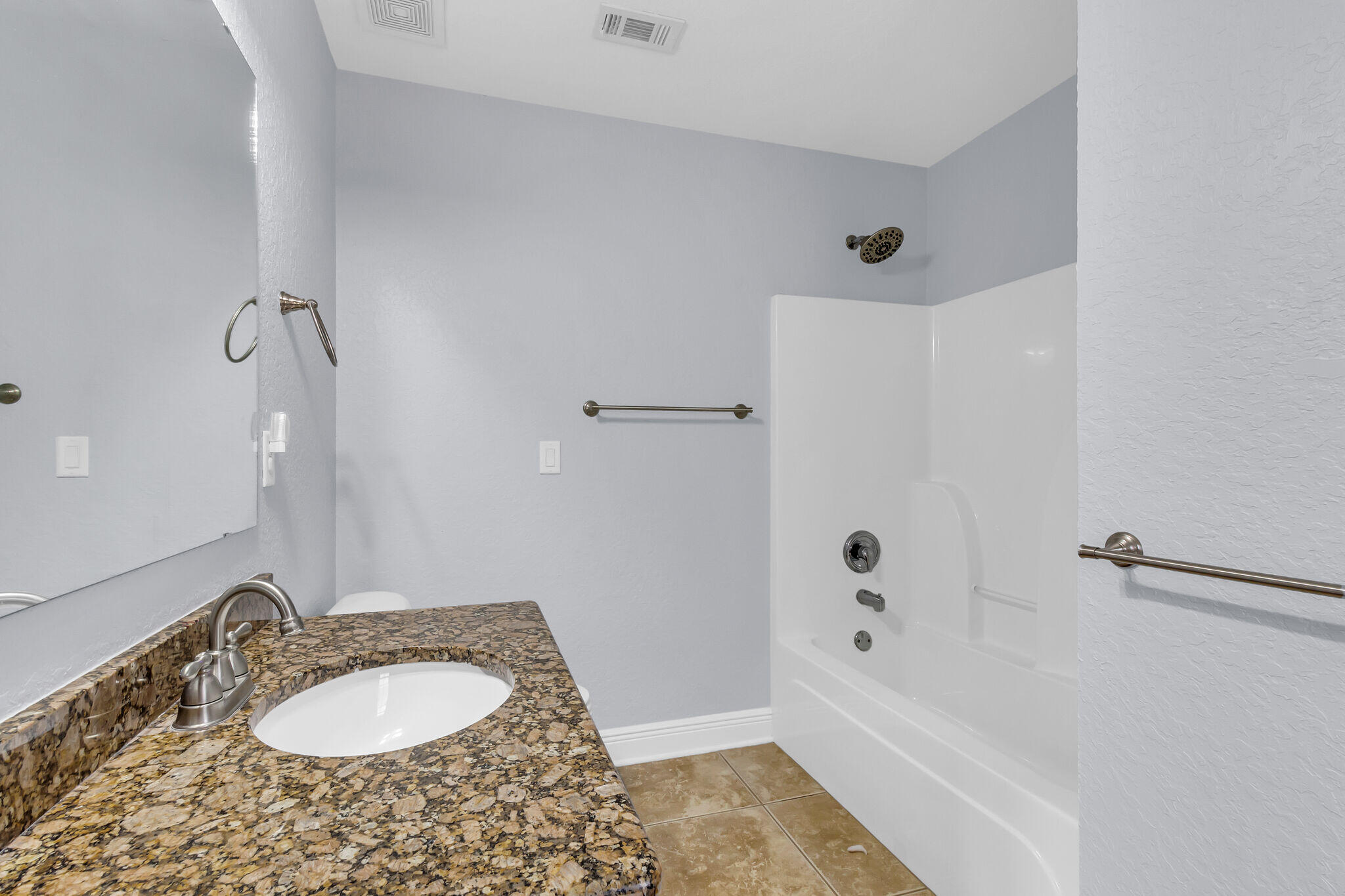 6181 Hummingbird Lane Crestview, FL 32536 - Photo 40 of 46 a bathroom with a granite countertop sink and a mirror