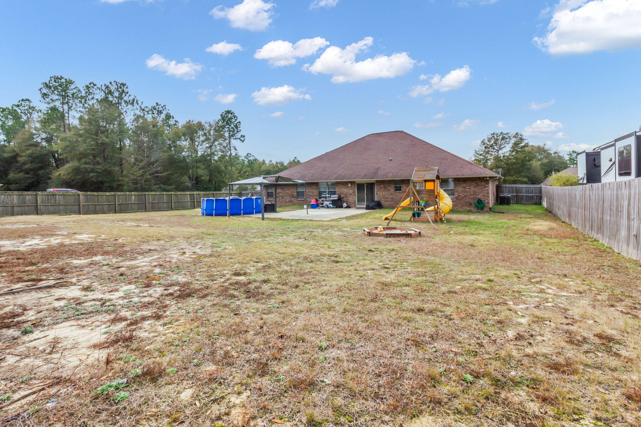 6181 Hummingbird Lane Crestview, FL 32536 - Photo 42 of 46 a view of a house with a yard