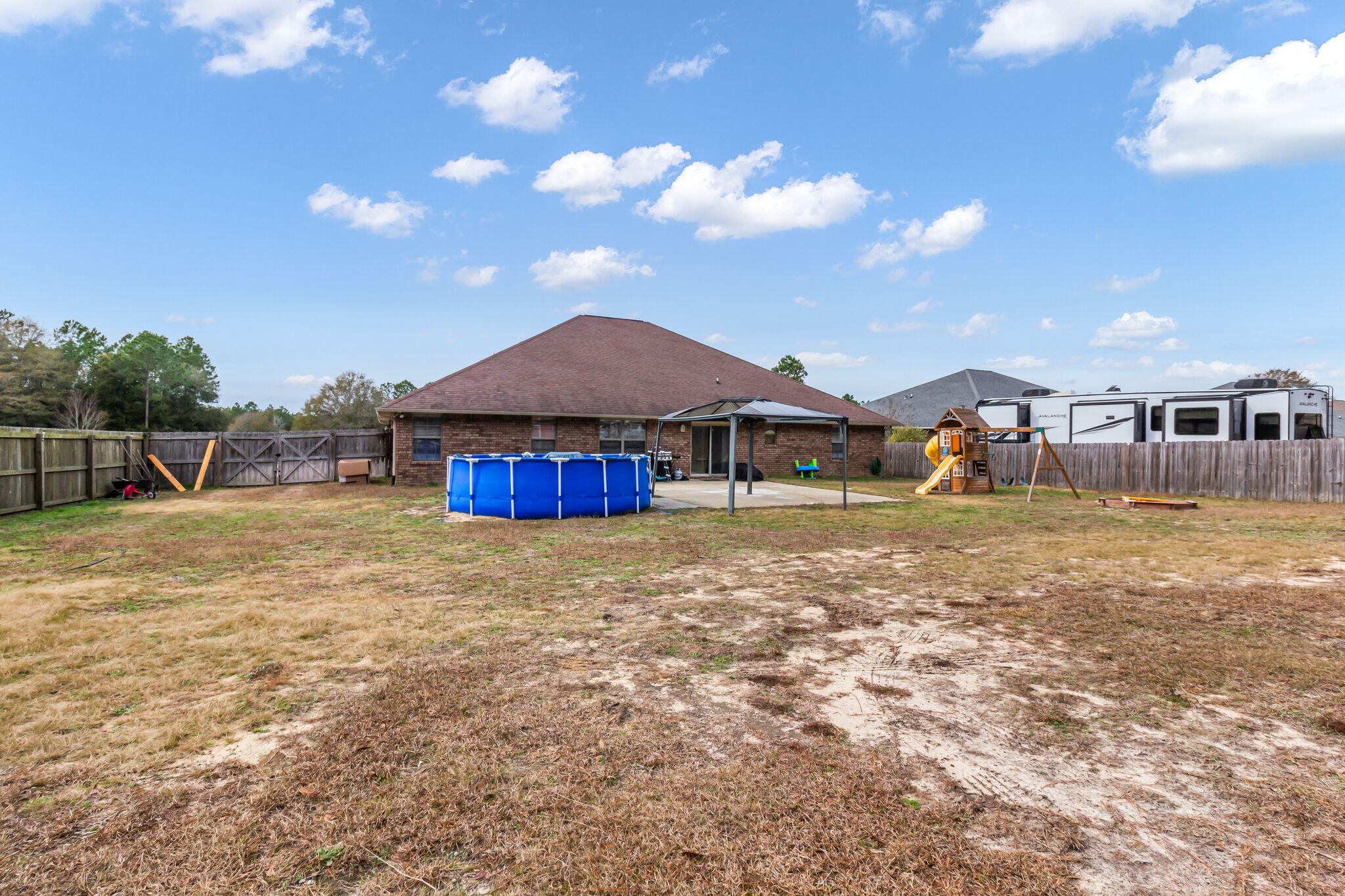 6181 Hummingbird Lane Crestview, FL 32536 - Photo 43 of 46 a view of a house with a yard