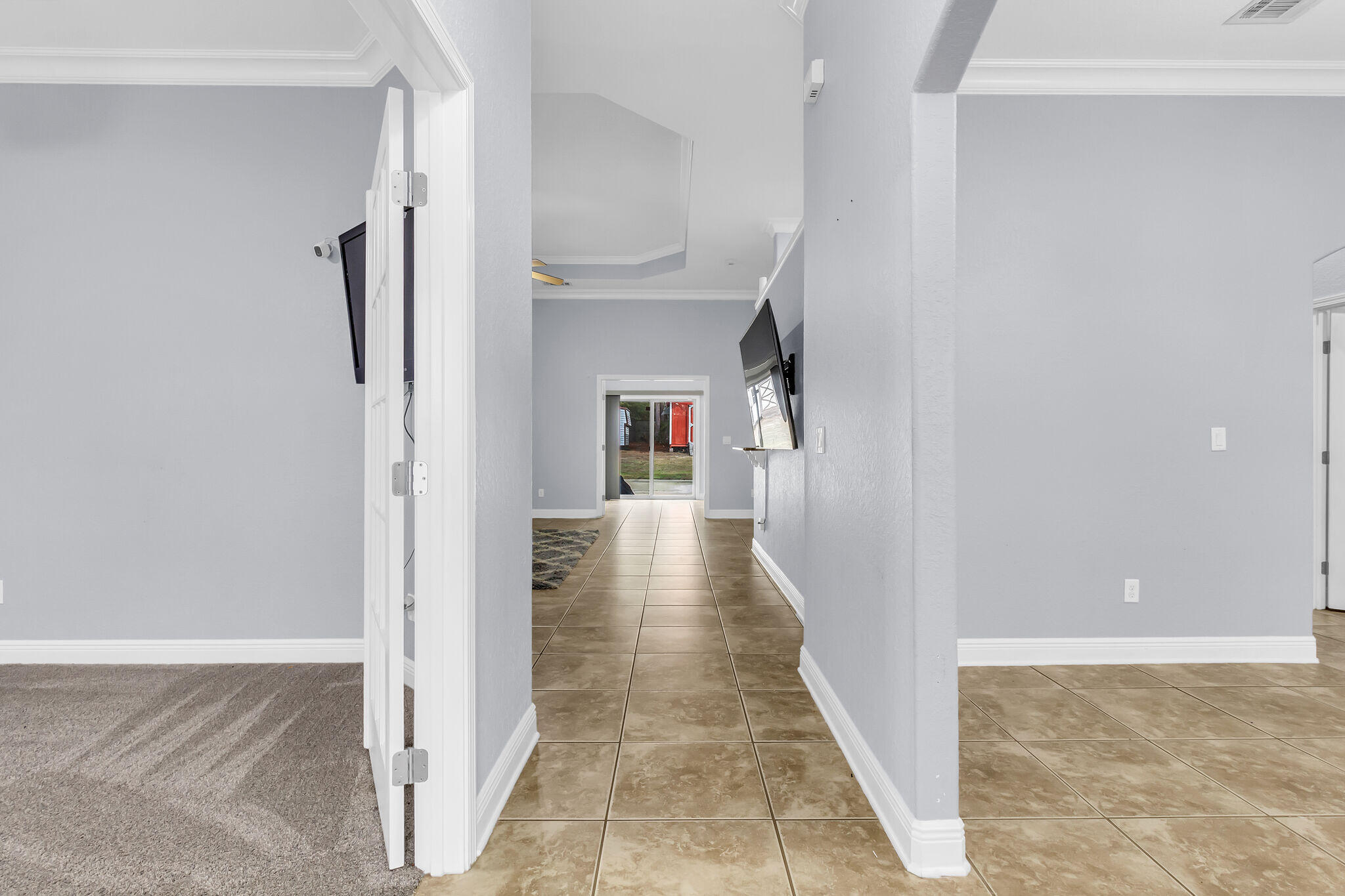 6181 Hummingbird Lane Crestview, FL 32536 - Photo 7 of 46 a view of a hallway with wooden floor and staircase