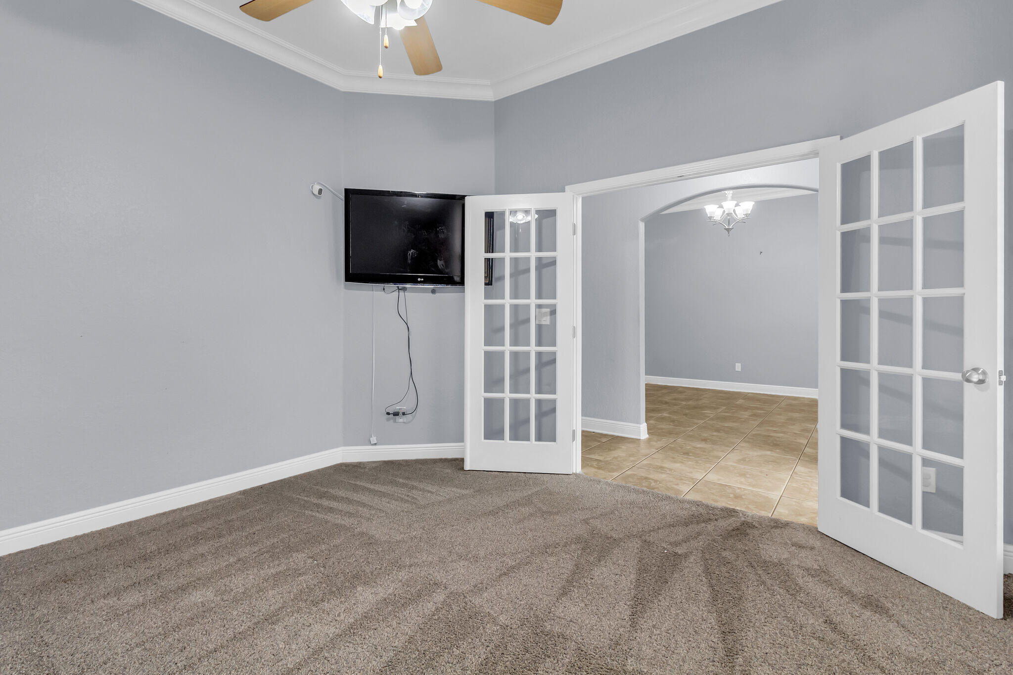 6181 Hummingbird Lane Crestview, FL 32536 - Photo 9 of 46 a view of an empty room with a fireplace and a window