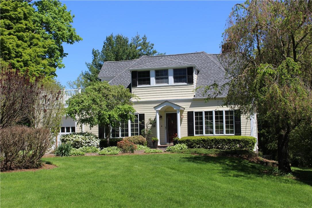 79 Highfield Road Harrison, NY 10528 - Photo 1 of 1 a front view of a house with a yard