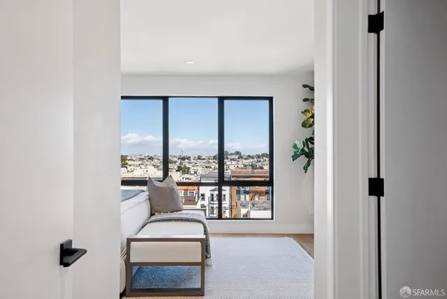 a room with a table and a potted plant