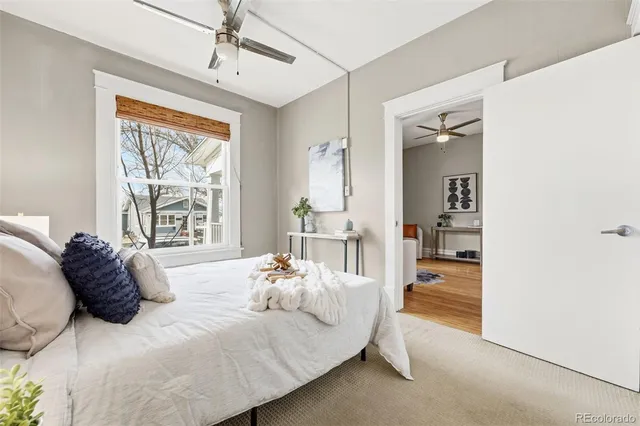 a bed room with a bed and a lamp