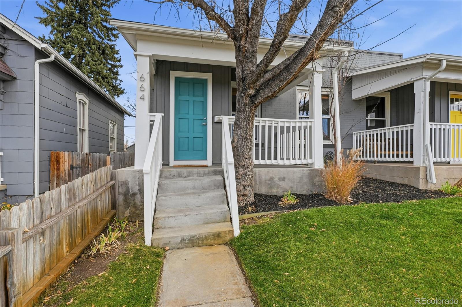 664 Meade Street Denver, CO 80204 - Photo 2 of 32 a front view of a house with a yard