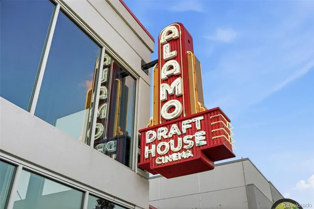 a front view of a building with parking