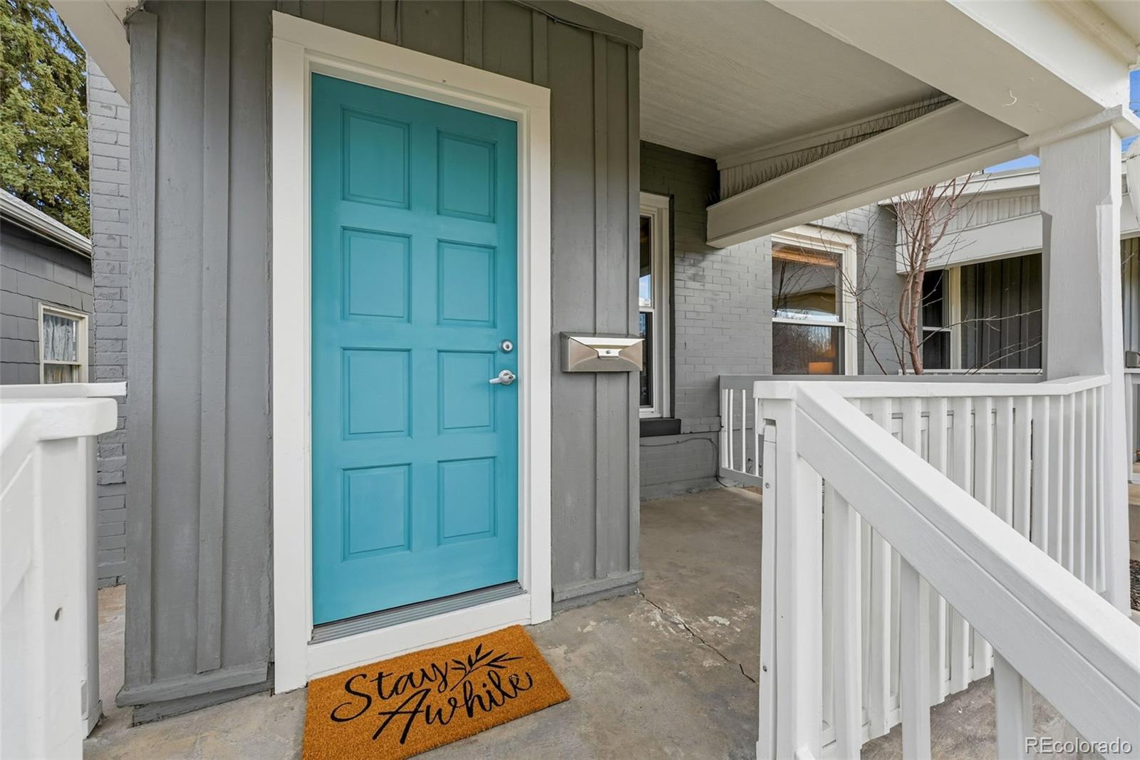 664 Meade Street Denver, CO 80204 - Photo 3 of 32 a view of a house with a door and wooden floor