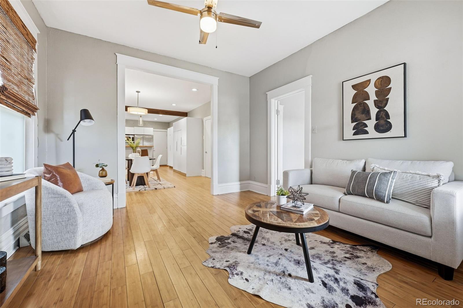 664 Meade Street Denver, CO 80204 - Photo 5 of 32 a living room with furniture and a wooden floor