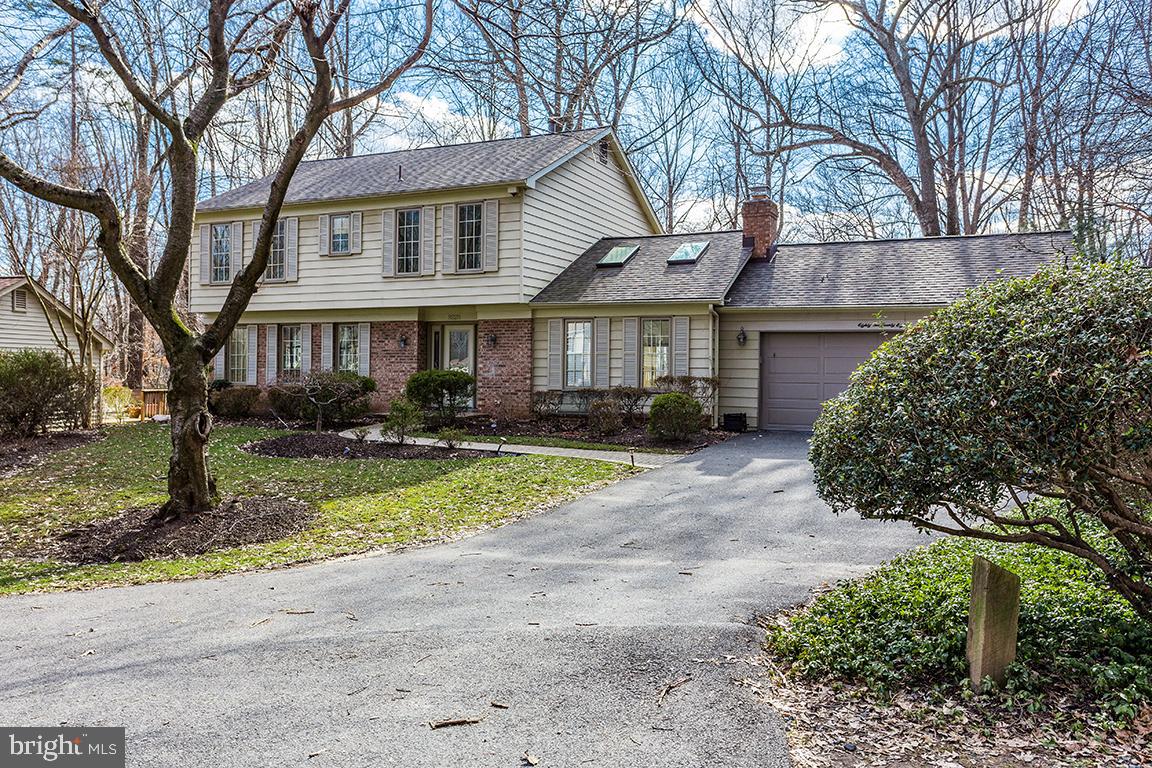 8228 Lakenheath Way Potomac, MD 20854 - Photo 2 of 41 a front view of a house with garden