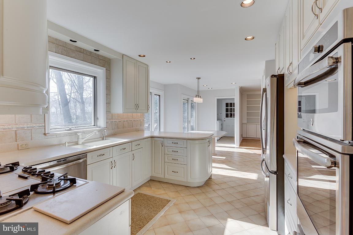 8228 Lakenheath Way Potomac, MD 20854 - Photo 13 of 41 a large kitchen with a large window