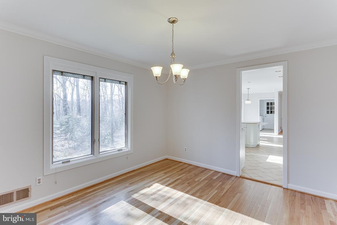 8228 Lakenheath Way Potomac, MD 20854 - Photo 14 of 41 a view of a room with wooden floor and windows