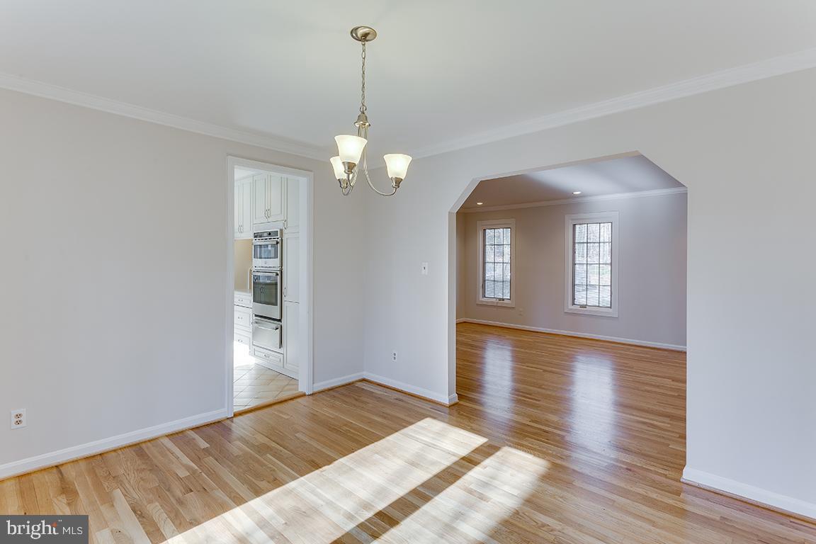 8228 Lakenheath Way Potomac, MD 20854 - Photo 15 of 41 a view of livingroom with hardwood floor and hallway
