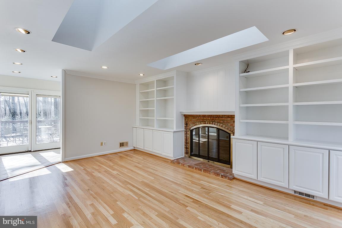 8228 Lakenheath Way Potomac, MD 20854 - Photo 8 of 41 a view of empty room with a fireplace and entryway