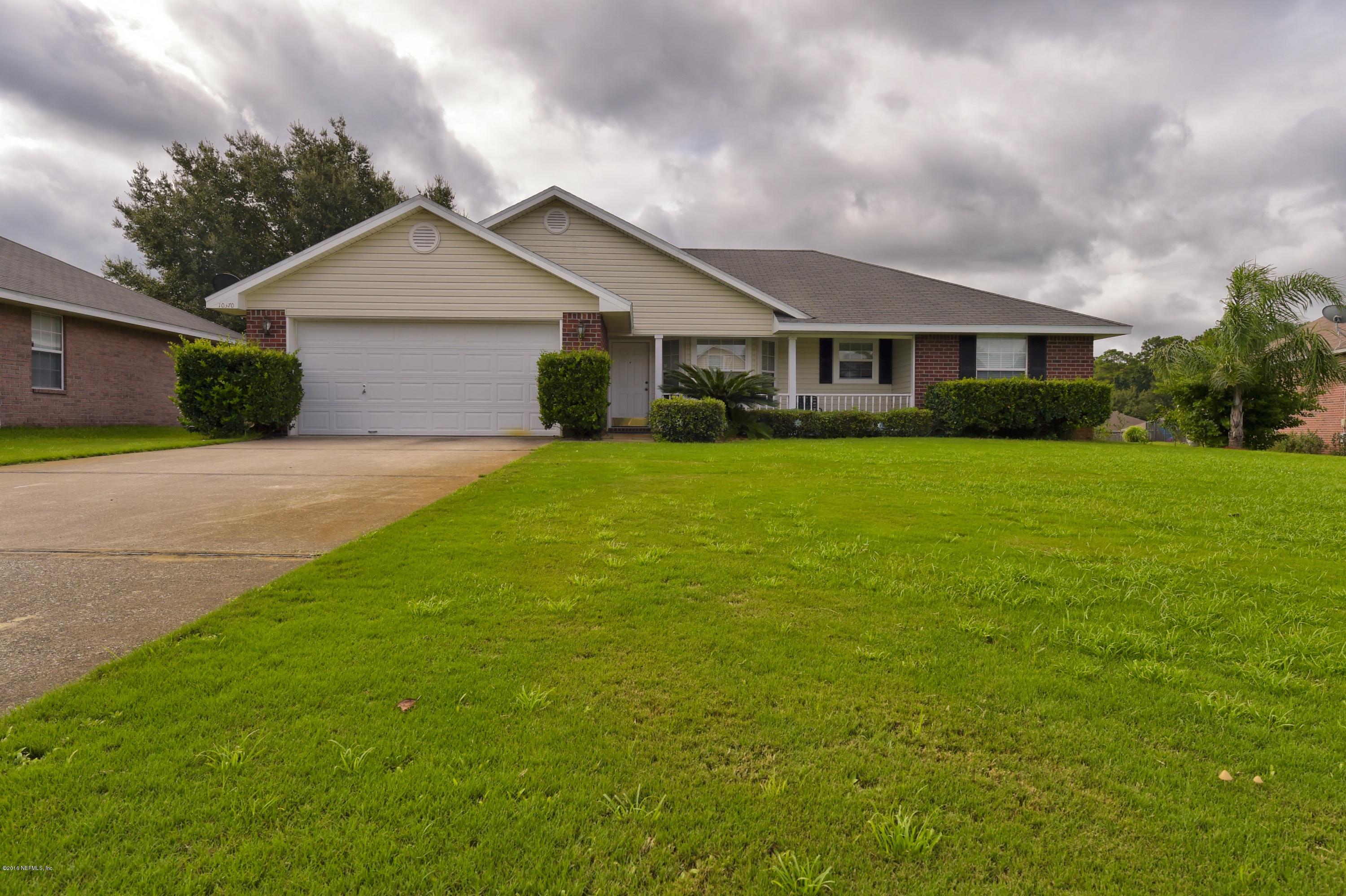 10370 Clayton Mill Road Jacksonville, FL 32221 - Photo 1 of 24 a front view of a house with yard