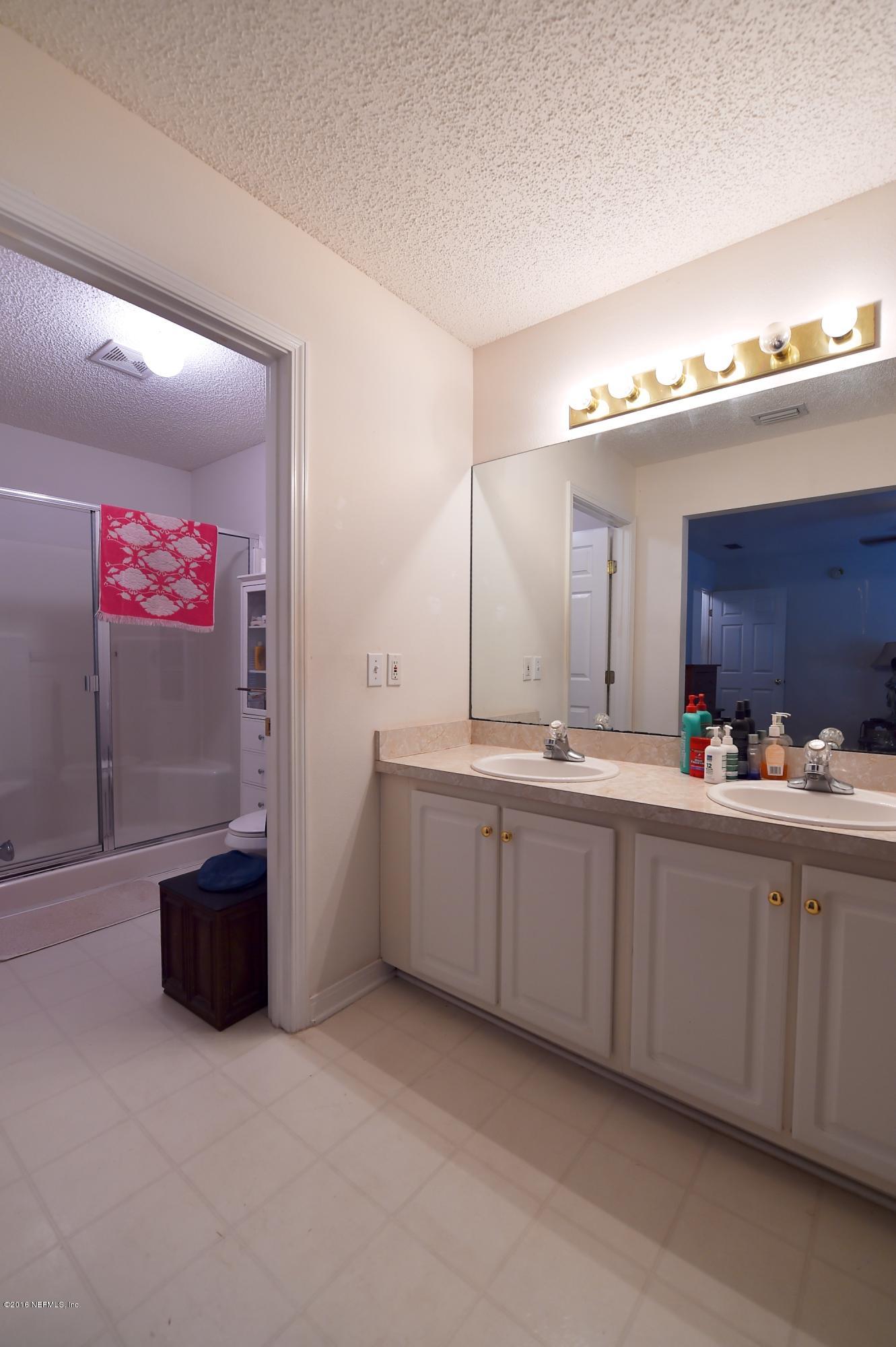 10370 Clayton Mill Road Jacksonville, FL 32221 - Photo 11 of 24 a spacious bathroom with a tub sink and mirror