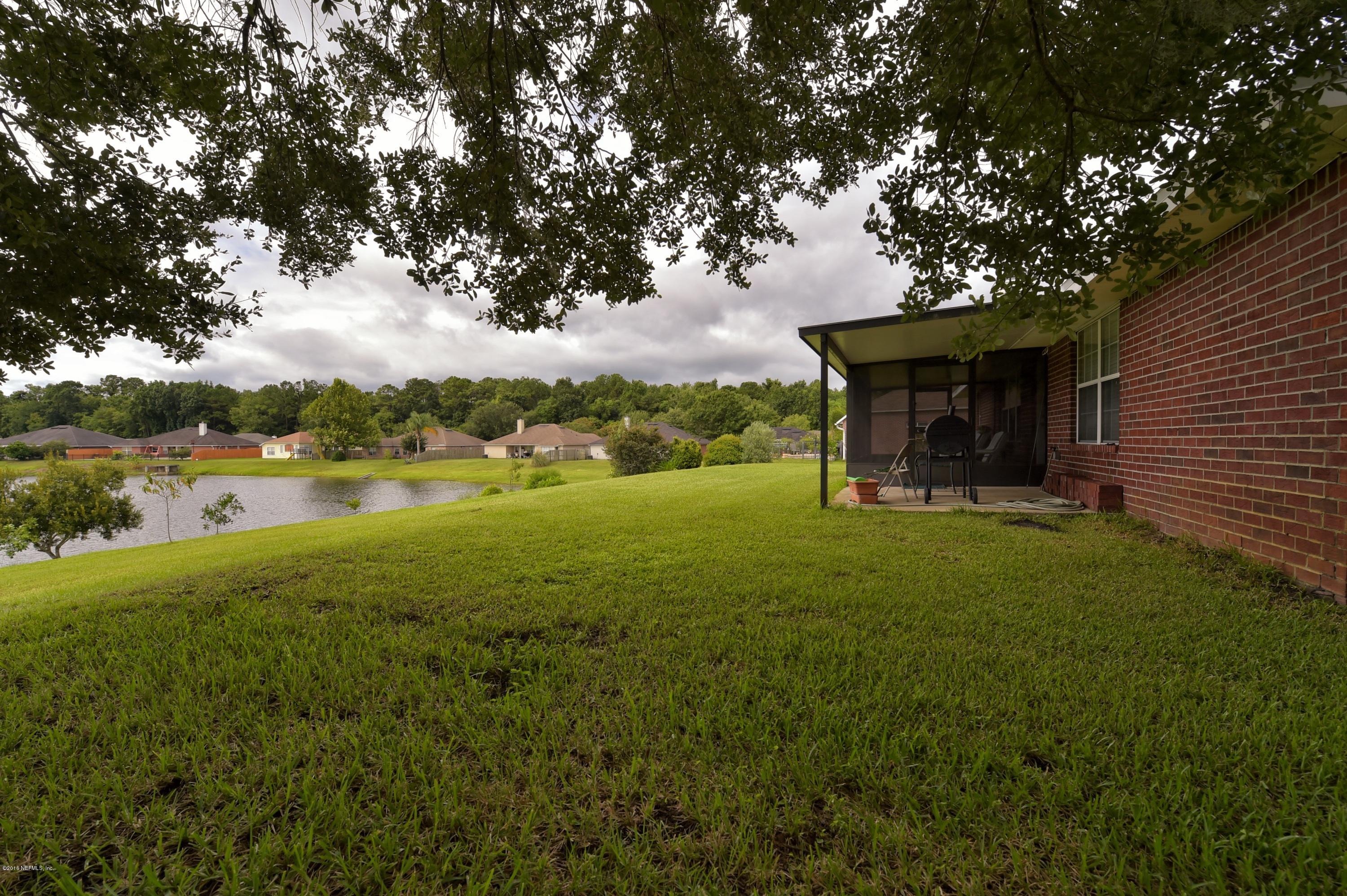 10370 Clayton Mill Road Jacksonville, FL 32221 - Photo 17 of 24 a view of outdoor space with deck and green space