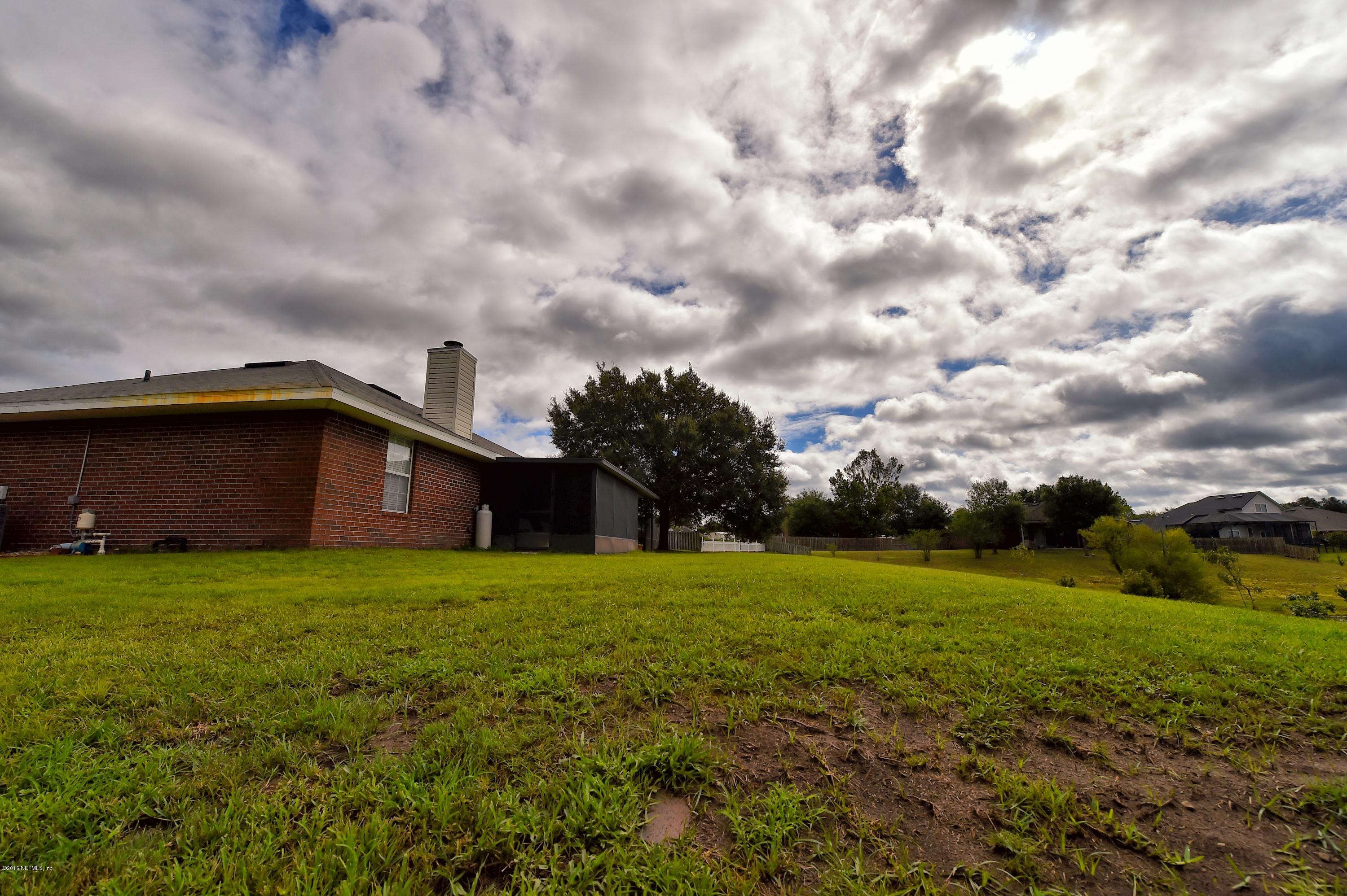 10370 Clayton Mill Road Jacksonville, FL 32221 - Photo 22 of 24 a view of a house with a yard