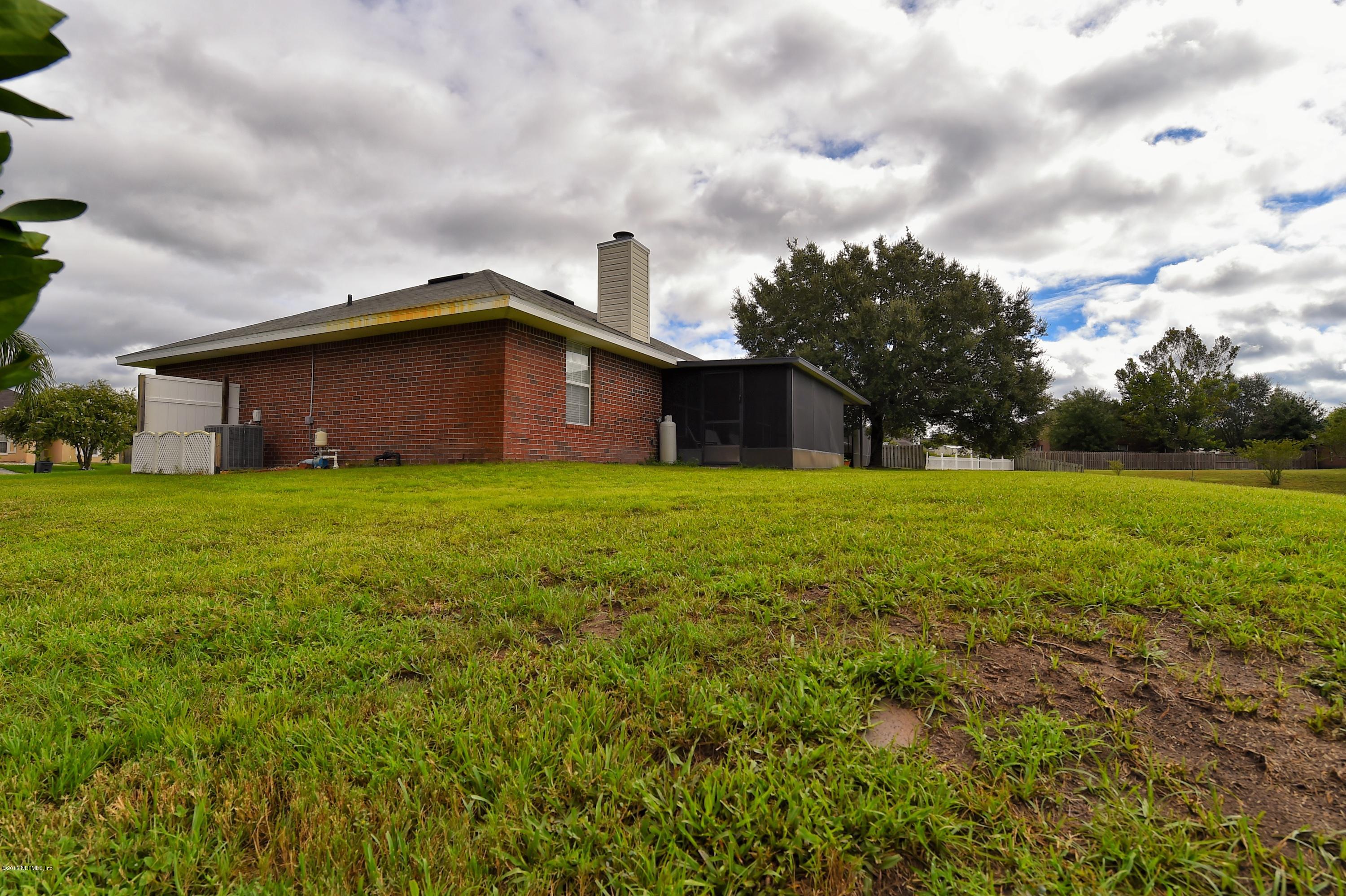 10370 Clayton Mill Road Jacksonville, FL 32221 - Photo 23 of 24 a view of a house with a yard