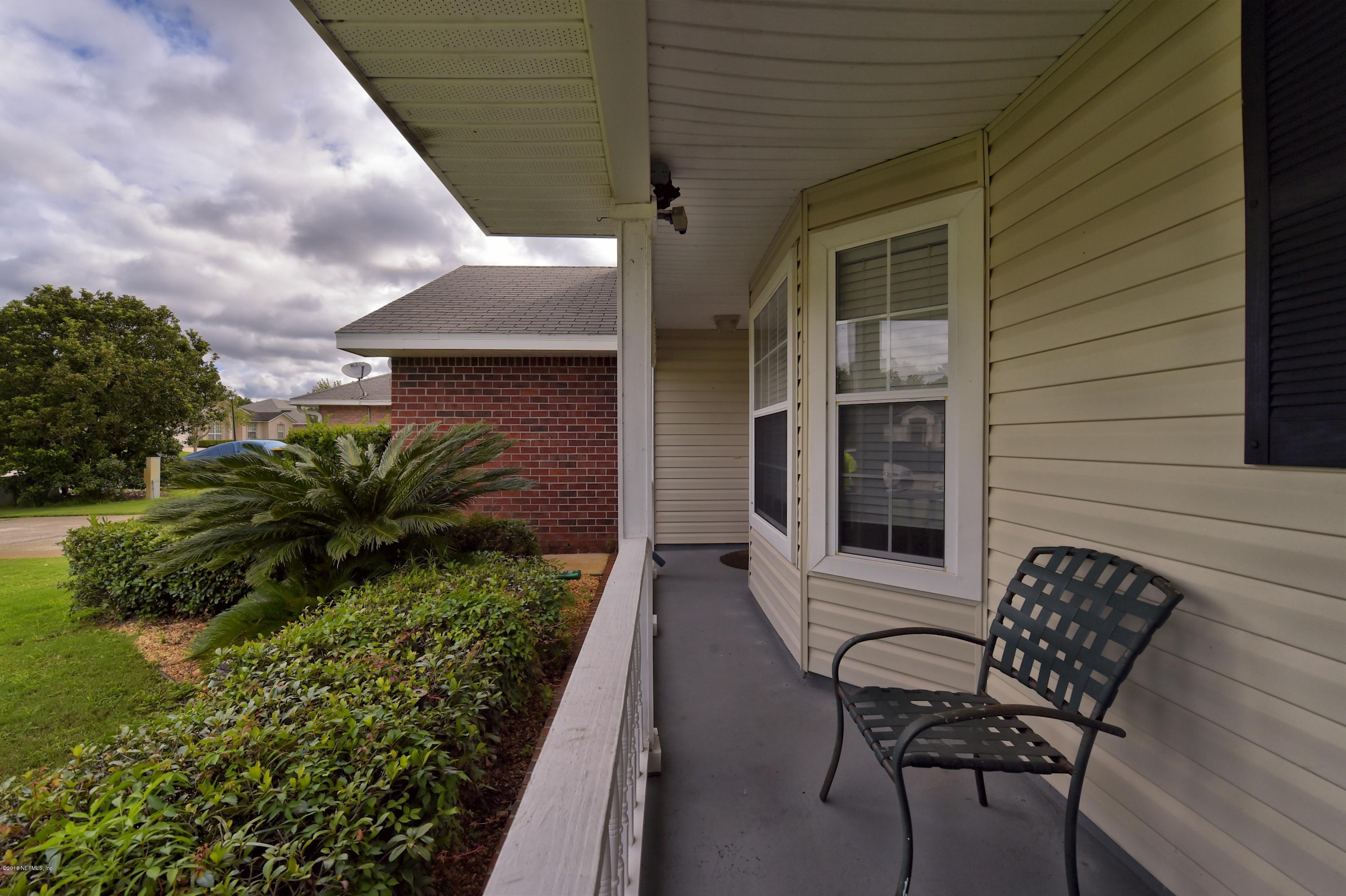 10370 Clayton Mill Road Jacksonville, FL 32221 - Photo 3 of 24 a view of a house with backyard and sitting area