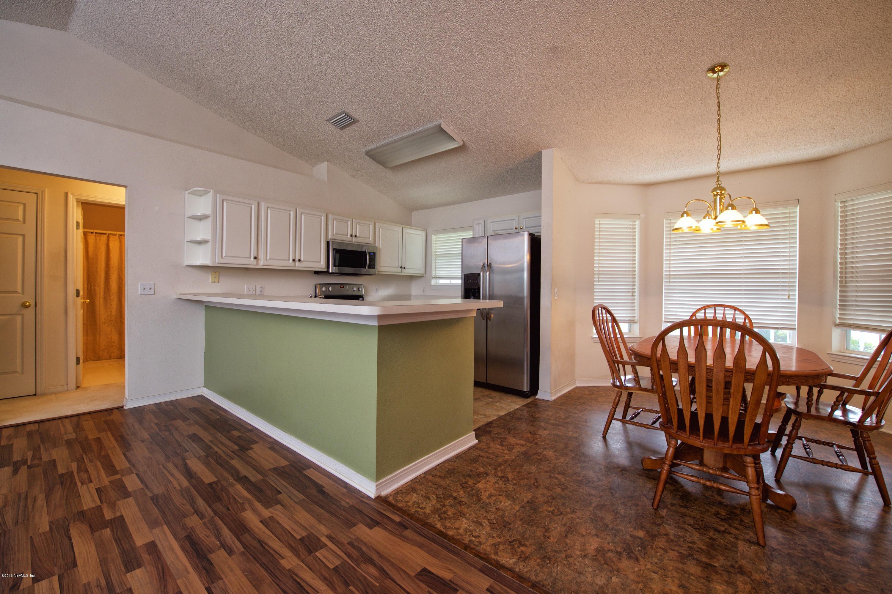 10370 Clayton Mill Road Jacksonville, FL 32221 - Photo 5 of 24 a dining room with furniture and window