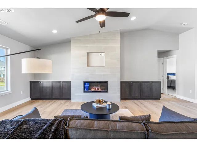 a living room with furniture and a fireplace