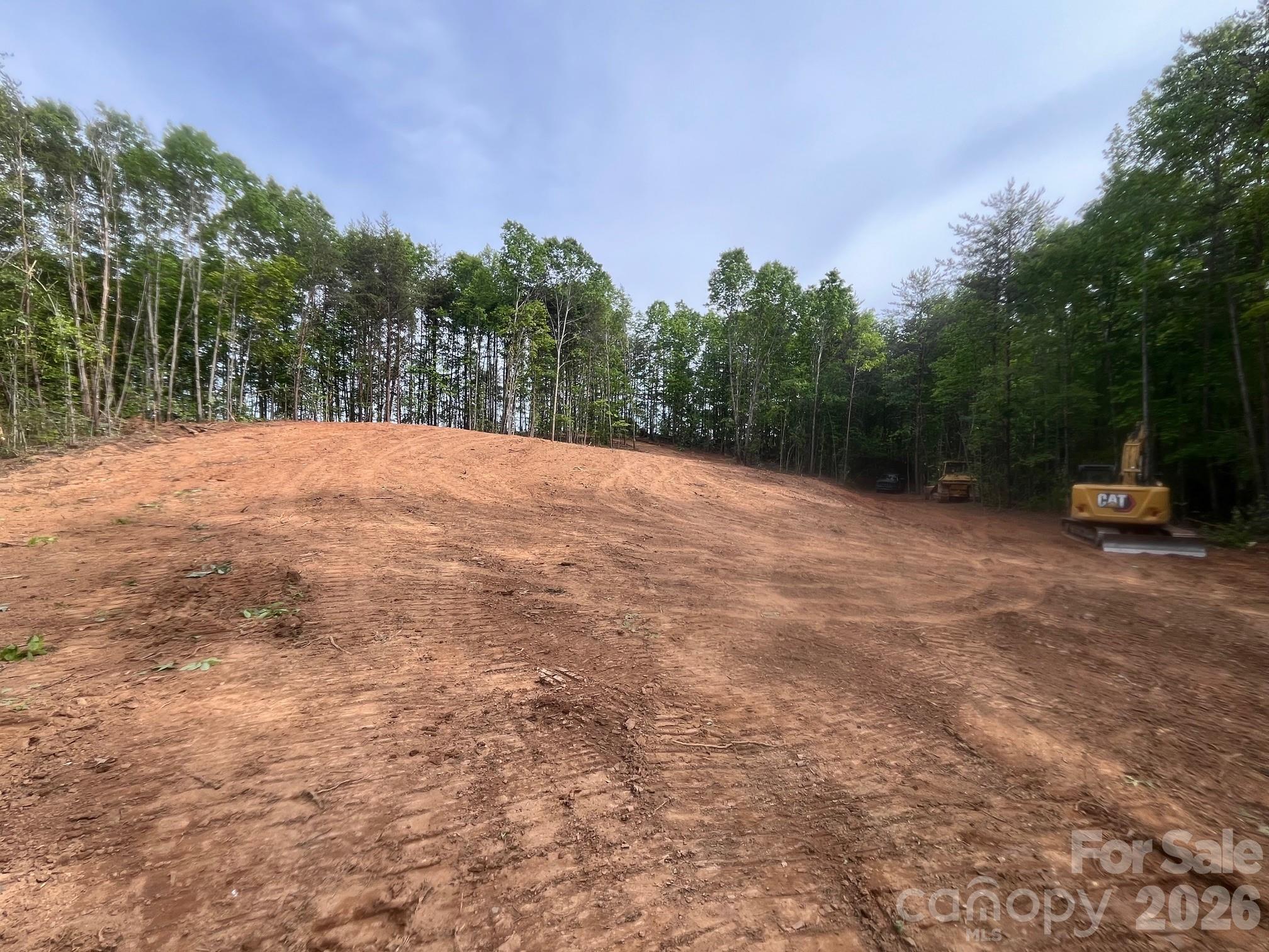 Tbd Vein Mountain Road, Unit 5 Nebo, NC 28761 - Photo 11 of 14 a backyard of a house with trees and wooden fence