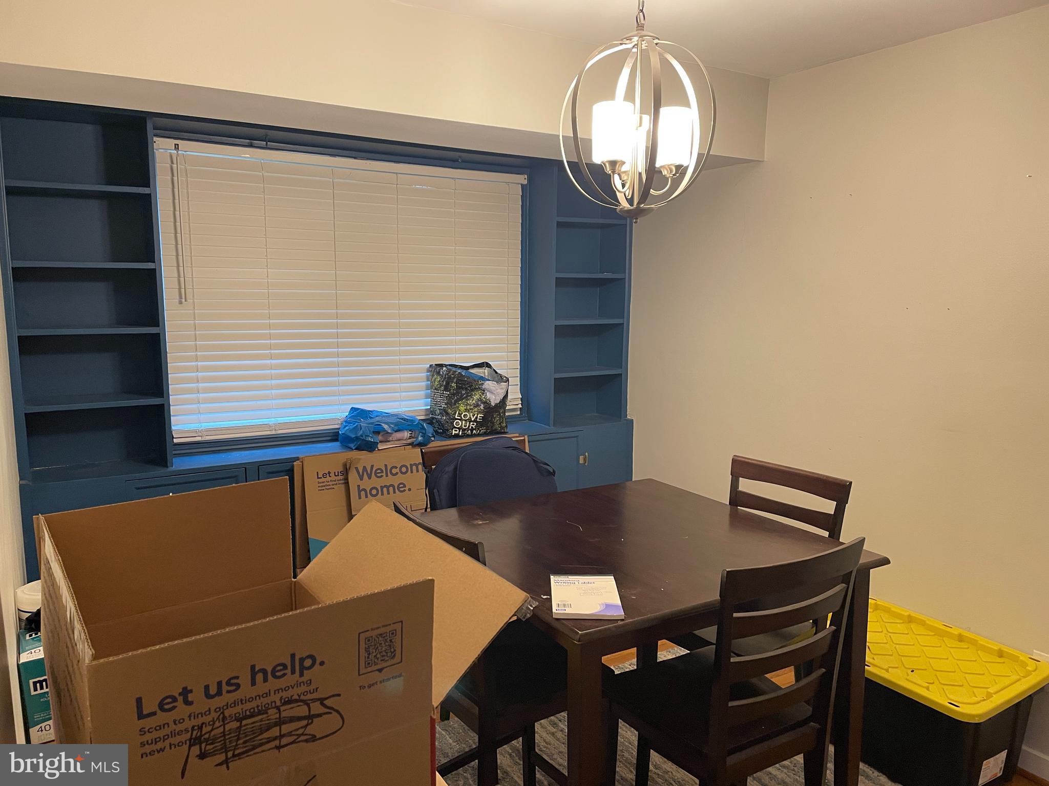 2307 Wyngate Road Suitland, MD 20746 - Photo 5 of 22 a view of a dining room with furniture and chandelier