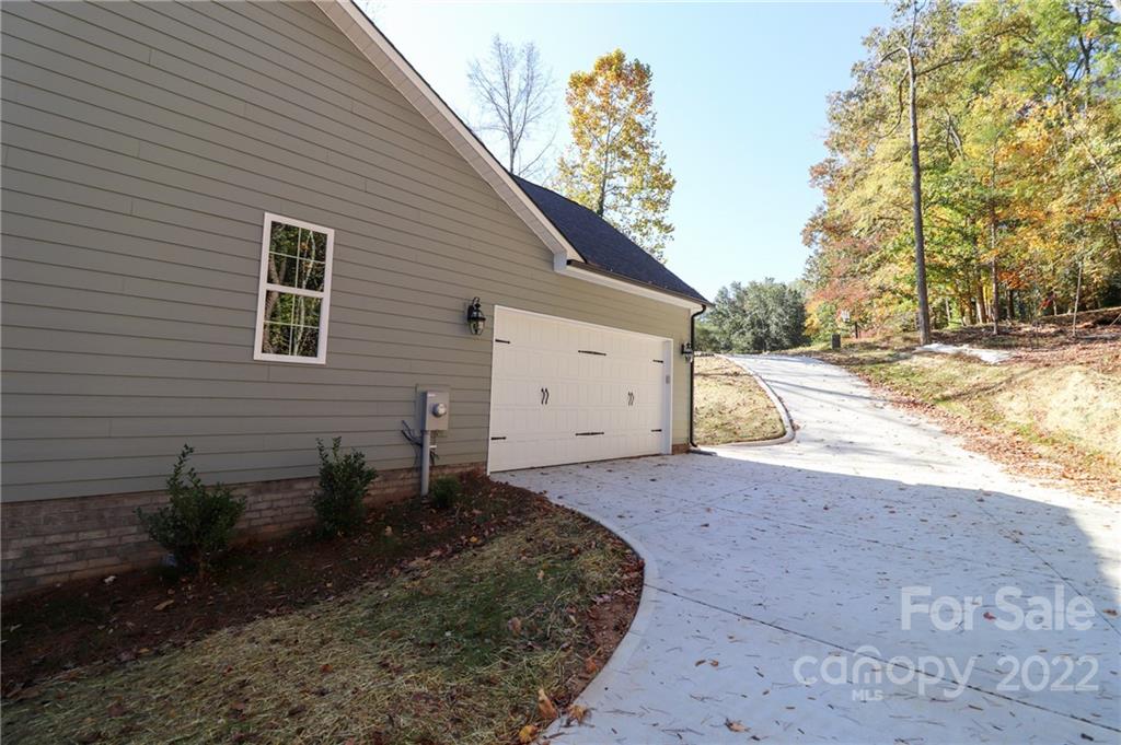 289 Ikerd Drive Southeast Concord, NC 28025 - Photo 20 of 24 a backyard of a house with lots of green space