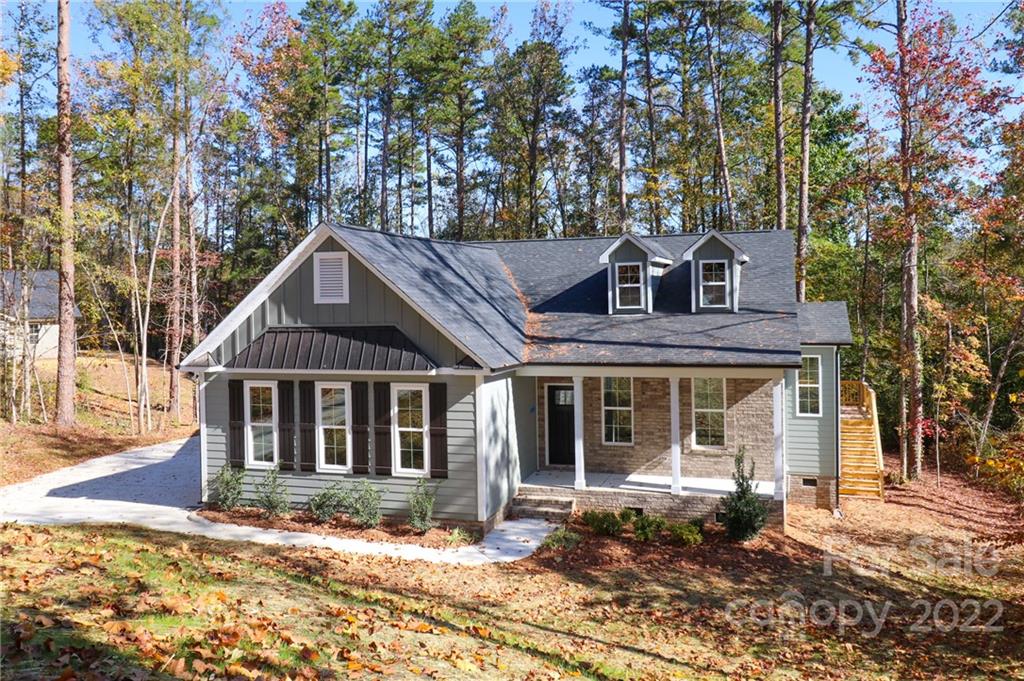 289 Ikerd Drive Southeast Concord, NC 28025 - Photo 2 of 24 a front view of a house with a garden
