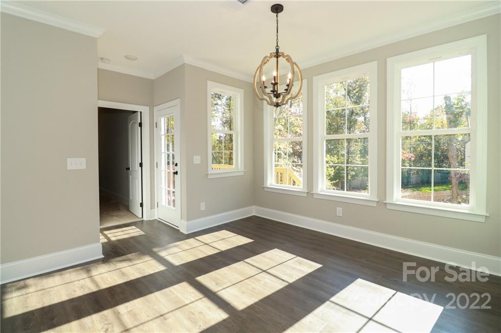 289 Ikerd Drive Southeast Concord, NC 28025 - Photo 7 of 24 a view of an empty room with windows