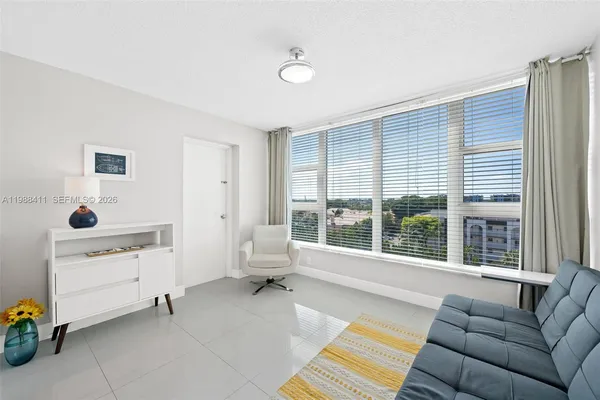 a living room with furniture and windows