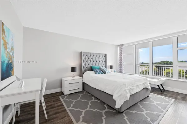 a bedroom with a large bed and a table