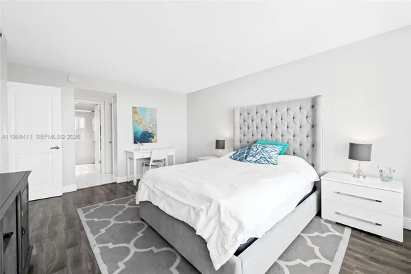 a bedroom with a bed and a table