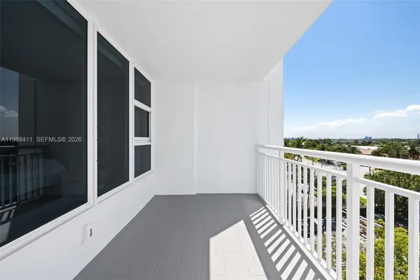 a view of a balcony with staircase