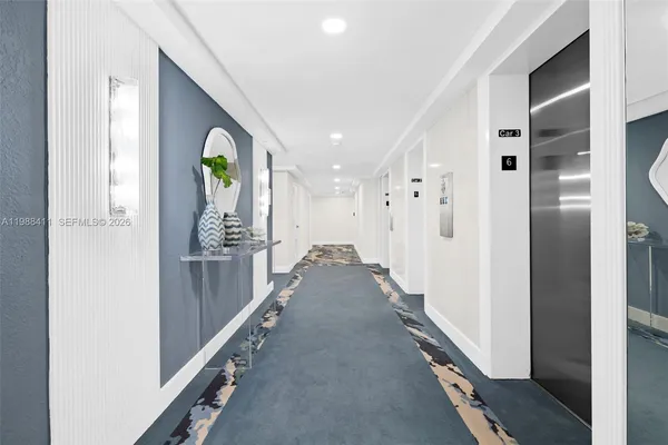 a view of a kitchen with storage and utility room