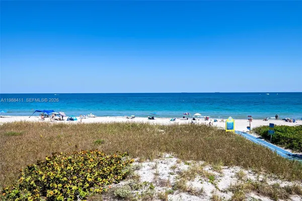a living room with furniture and painting on the wall