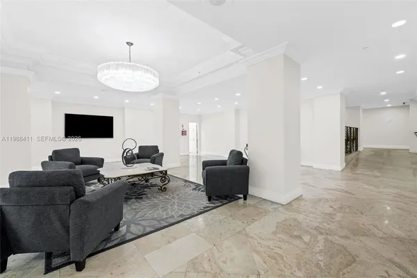 an entryway with a dining room and hall with a view of dining room