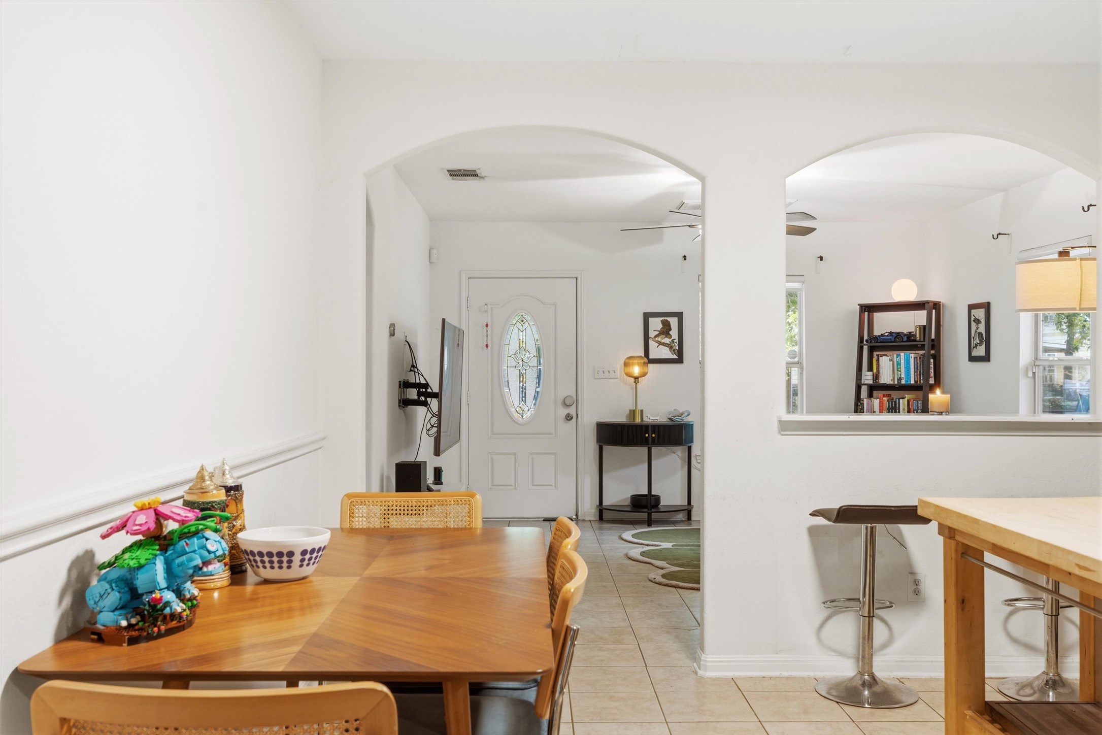 3015 Castro Street Austin, TX 78702 - Photo 10 of 40 An inviting dining area flows seamlessly into the entry and kitchen, creating an open and airy living space.