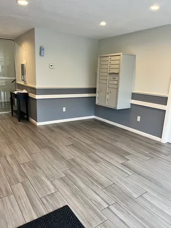 a view of a room with cabinet and mirrors