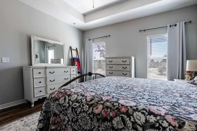 a bedroom with a bed and a dresser