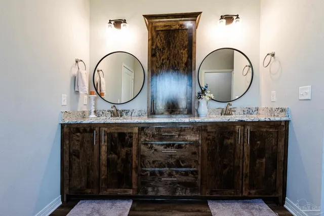 a bath tub sitting in a bathroom next to a sink