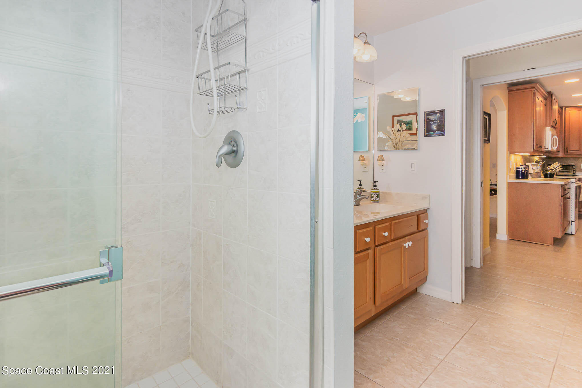 1720 Benjamin Road Malabar, FL 32950 - Photo 8 of 46 a view of a bathroom from the hallway