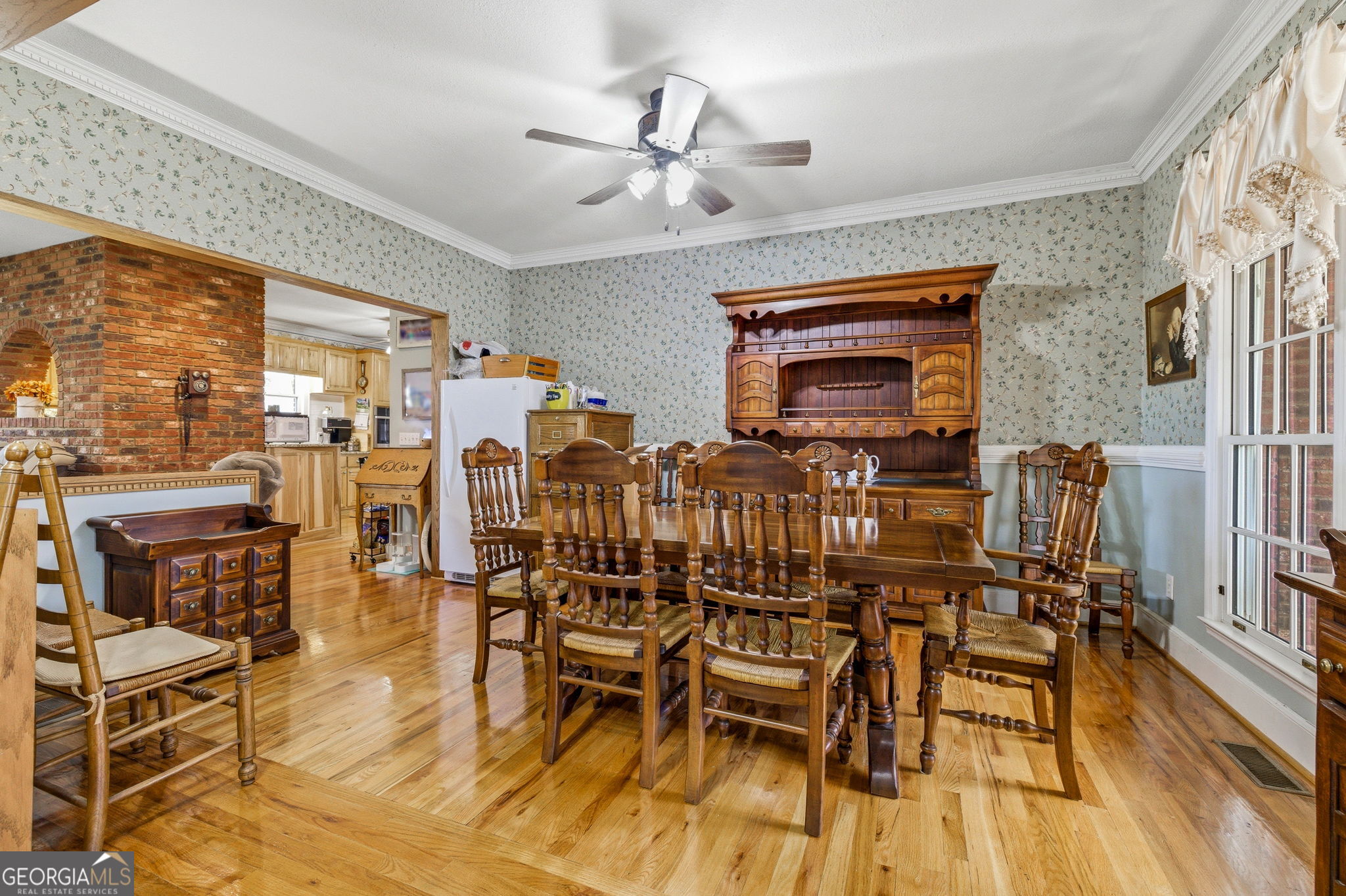 401 Herrin Road Cornelia, GA 30531 - Photo 11 of 83 a view of a dining room with furniture wooden floor and a chandelier