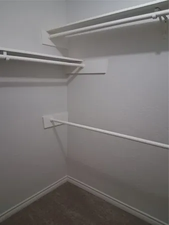 a view of a room with racks on the wall