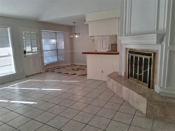 a bedroom with a bed and a fireplace