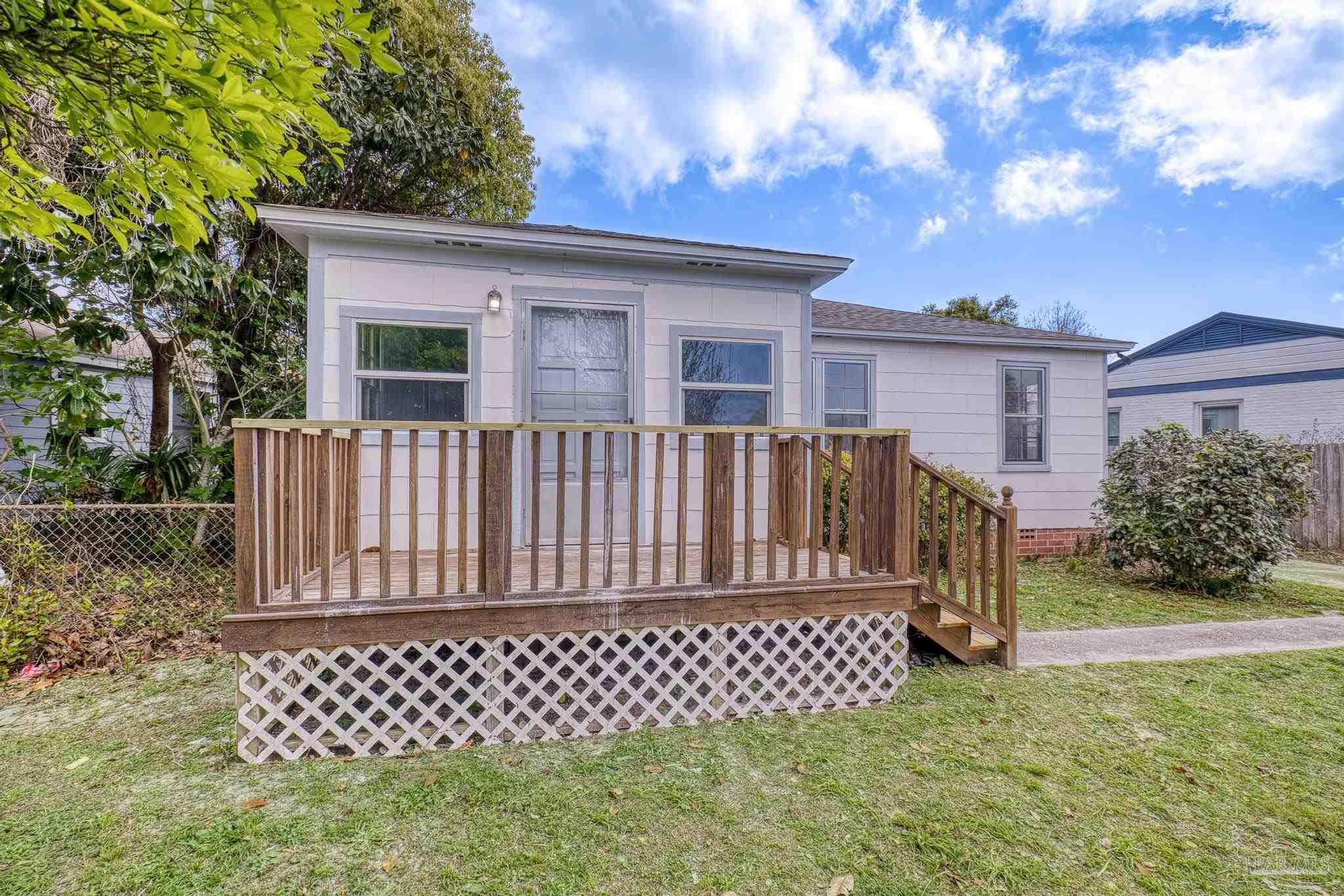208 Berry Road Pensacola, FL 32507 - Photo 3 of 41 a view of a house with wooden fence