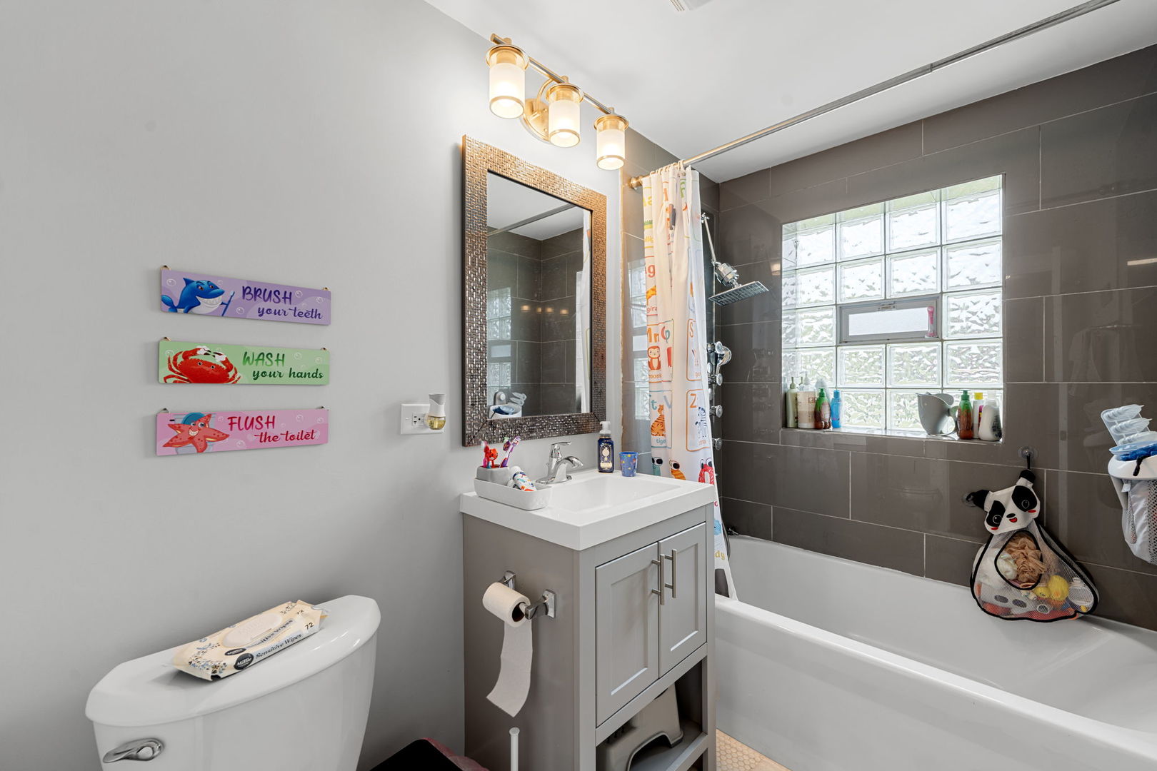 2256 18th Avenue North Riverside, IL 60546 - Photo 11 of 33 a bathroom with a sink mirror vanity and toilet