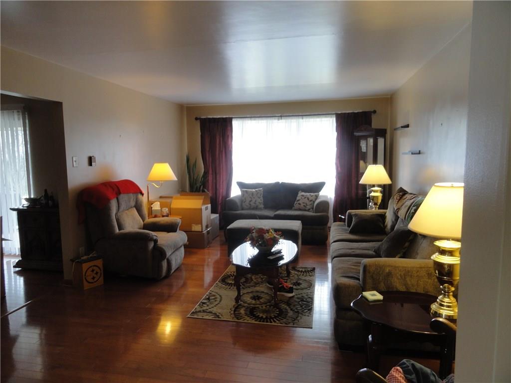 18 Beagle Club Road Washington, PA 15301 - Photo 3 of 25 Generous space in living room, gorgeous hardwood flooring, bow window allows outside in!
