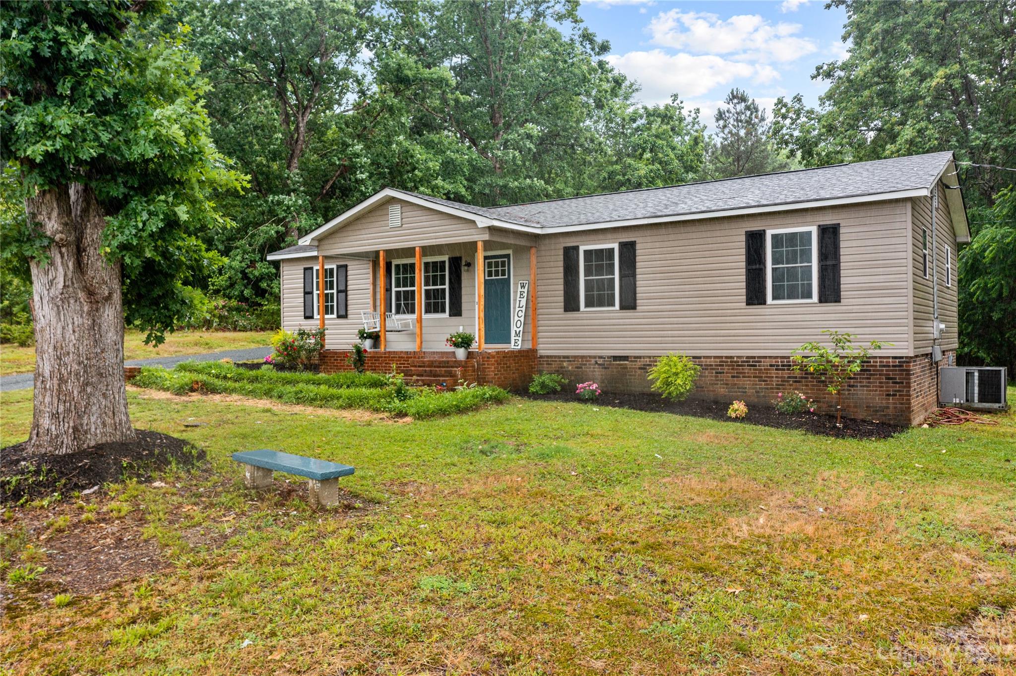 1809 Feature Road Lancaster, SC 29720 - Photo 2 of 32 a front view of a house with garden