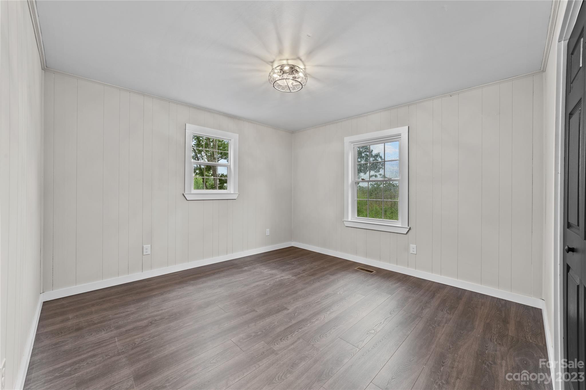 1809 Feature Road Lancaster, SC 29720 - Photo 21 of 32 a view of an empty room with wooden floor and a window